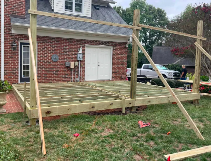 New deck with pergola and porch under construction — Hickory NC deck builders